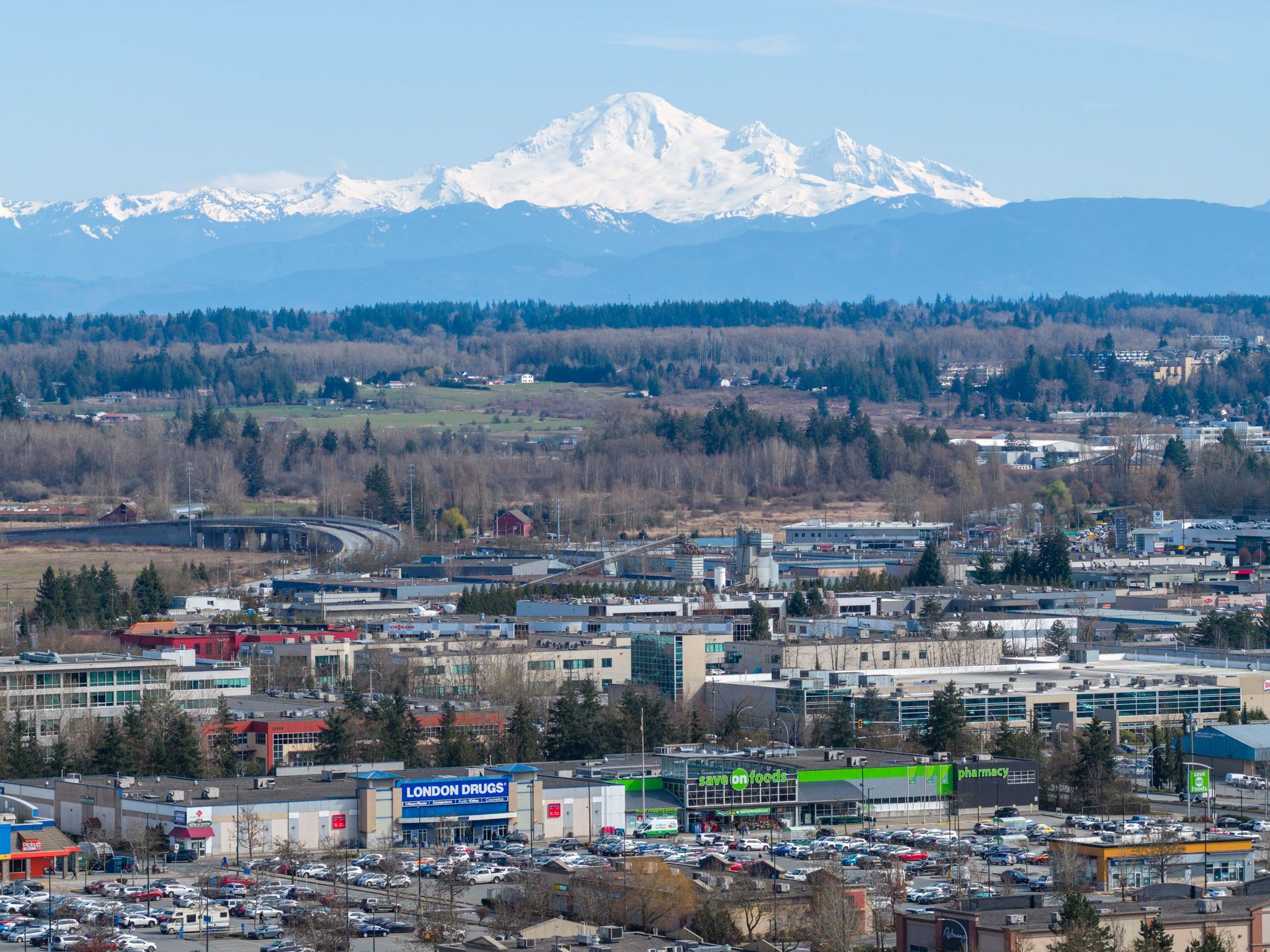 Mount Baker rising over Langley, shot from a drone
