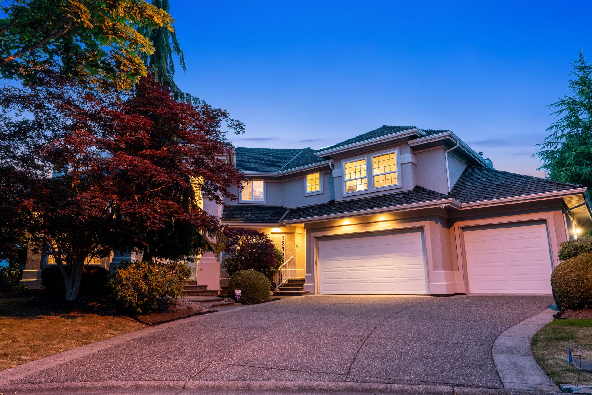 Twilight front exterior with the lights on