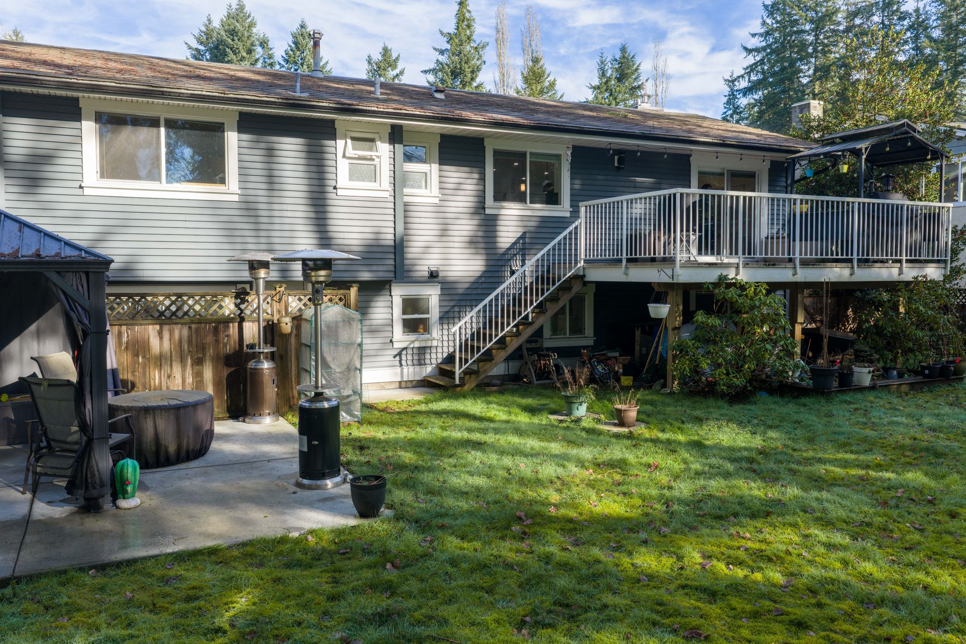 Back of a Langley home with a deck and lawn