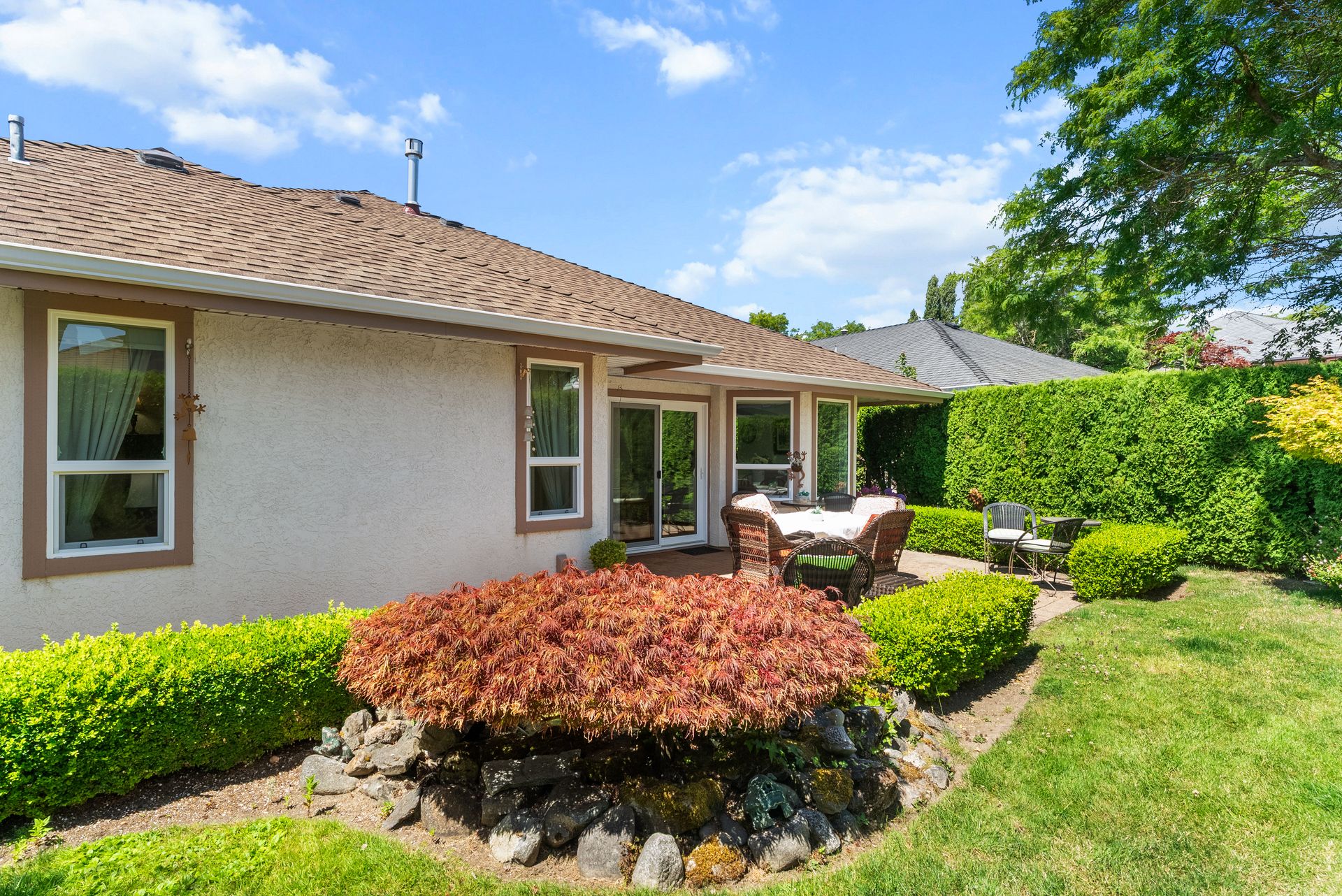 Front exterior and garden on a sunny day