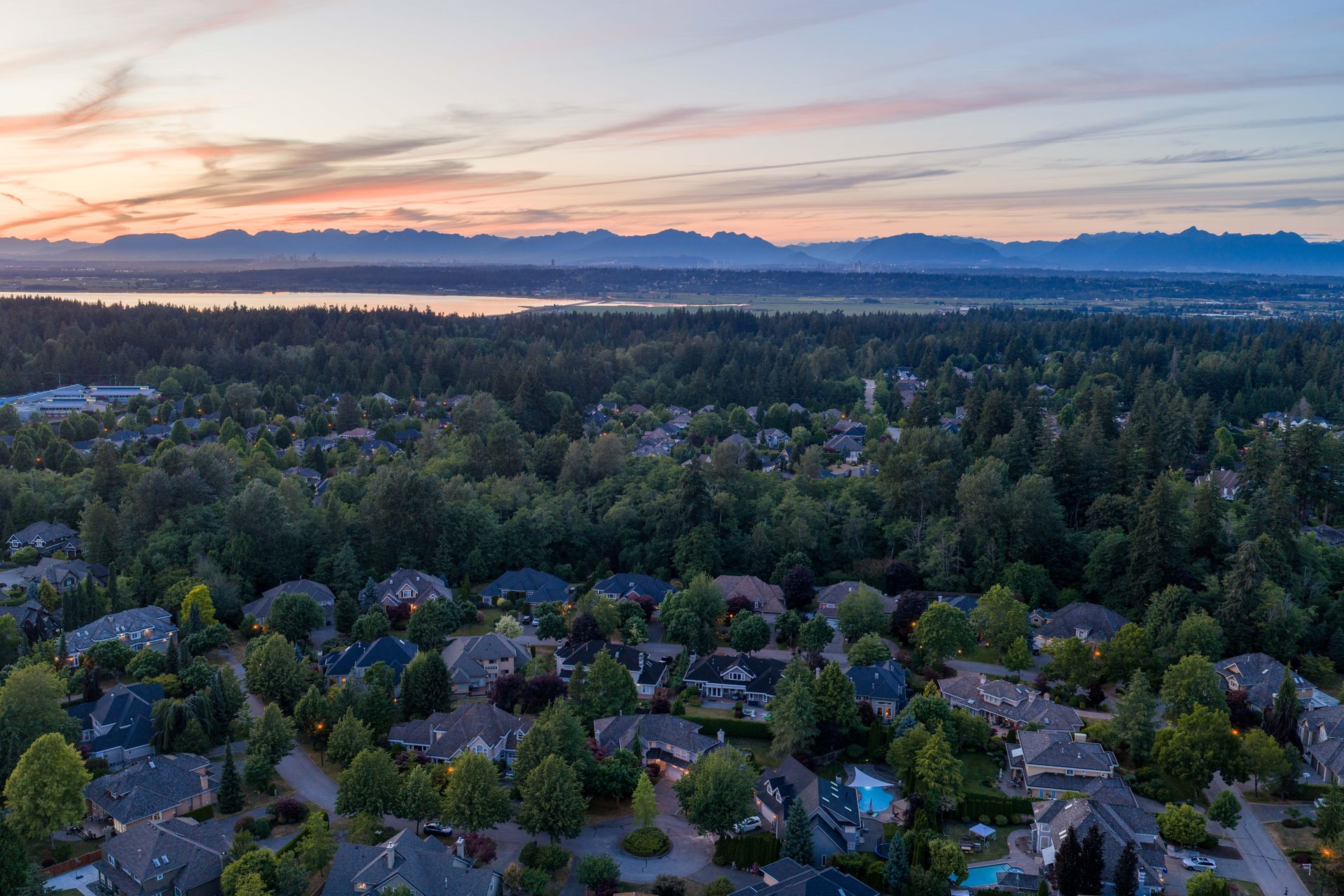 Sunset drone view over South Surrey toward the water