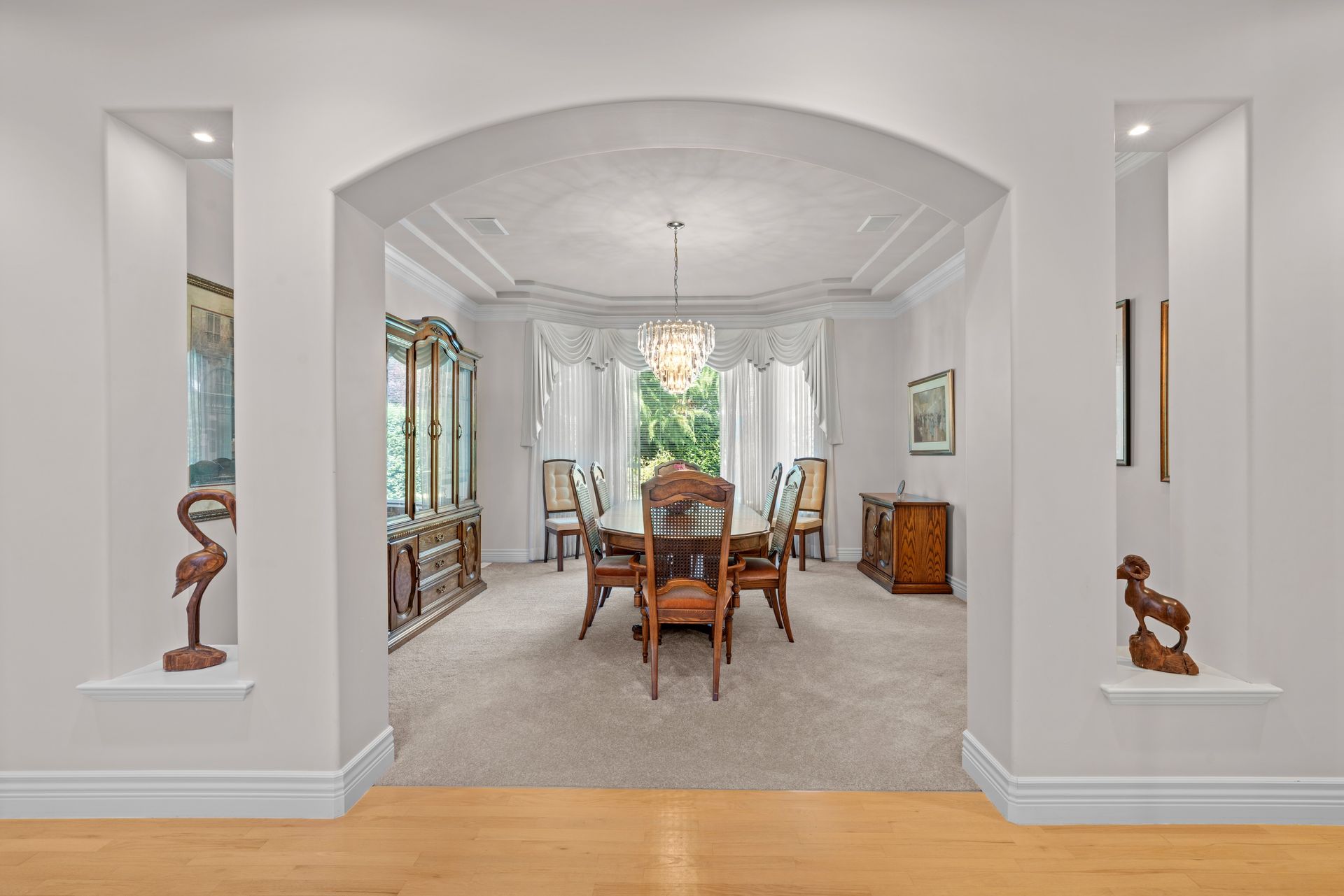 Dining room through an arched opening