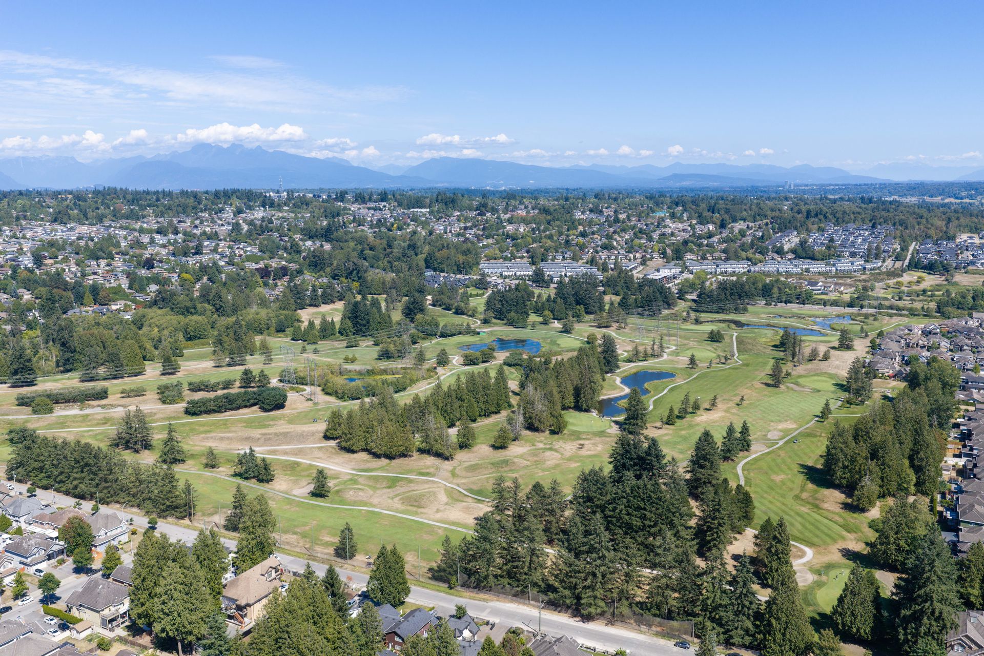 Drone view over the neighbourhood and the golf course