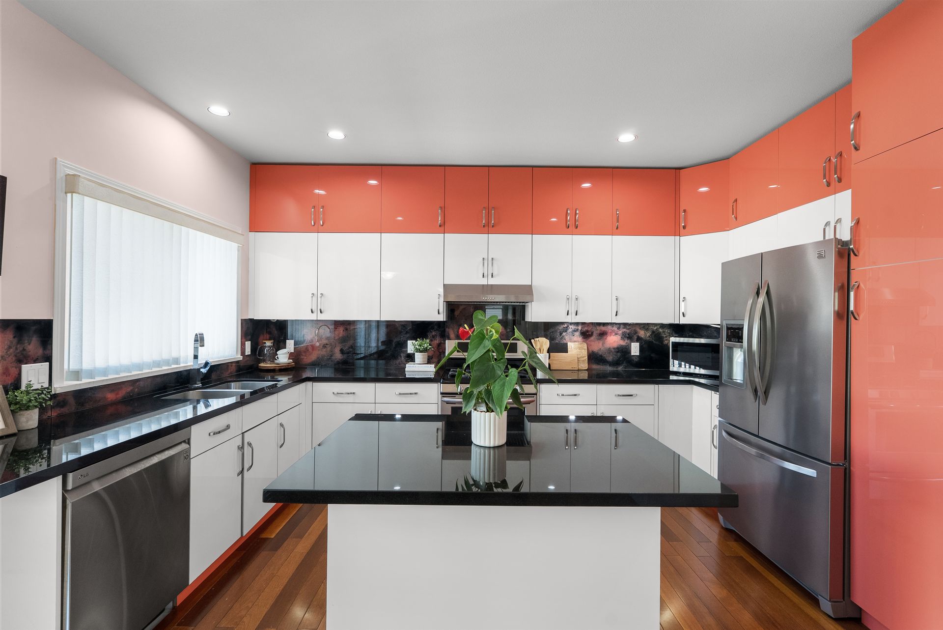 Kitchen with an island and stainless appliances