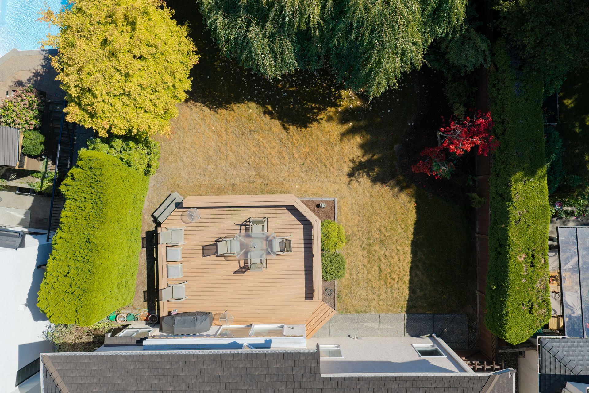 Top down drone view of the home and the backyard