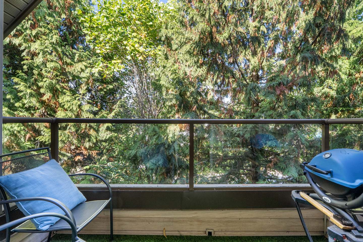 Large balcony with a treed outlook